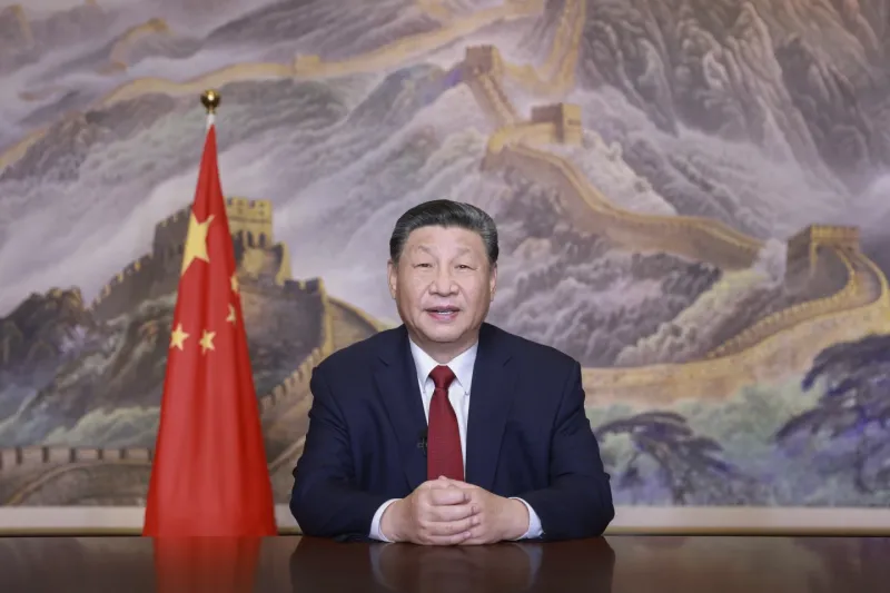 In his New Year message, Chinese President Xi Jinping promises to promote world peace and development